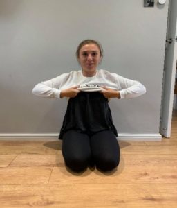Girl gripping the jumper with both hands