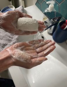 Person lathering soap with their hands