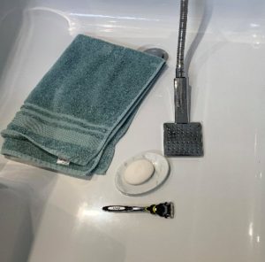 Picture of a towel, razor and soap