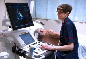 Nurse performing a scan on a patient