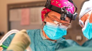 Dr Fiona Tsang-Wright, Consultant Breast and Reconstructive Surgeon (centre) with Mr Hussein Al-Musawy, Specialty Doctor (to the right of the picture).